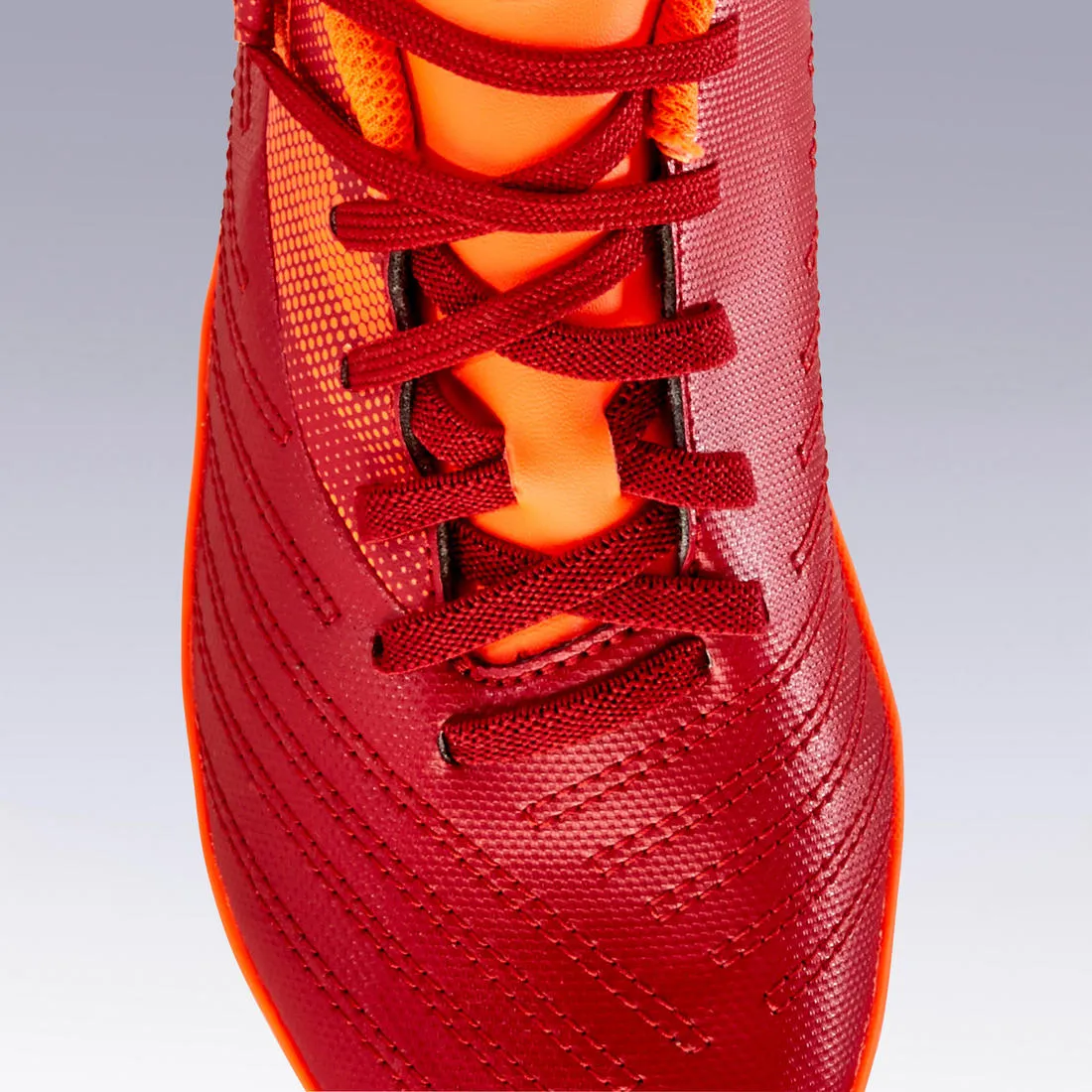 Chaussure de football enfant terrain sec AGILITY 140 FG Scratch Rouge Bleue