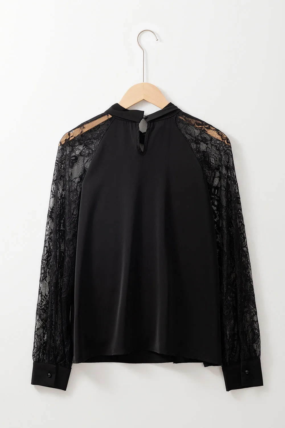Chemisier noir à manches raglan en dentelle florale *